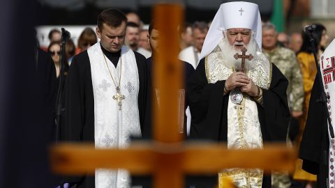 Dignitaries and families attend a ceremony for the fallen soldiers of Ukraine on the Field of Mars on Wednesday in Lviv.