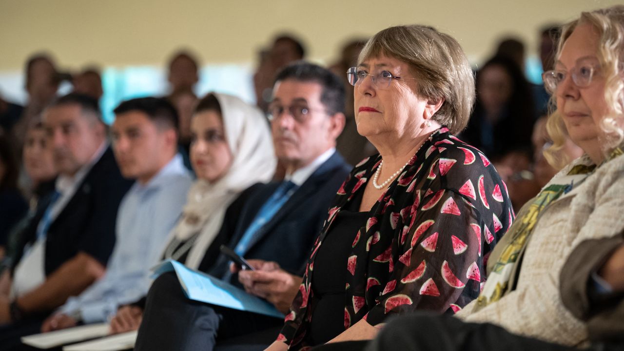 Outgoing United Nations High Commissioner for Human Rights Michelle Bachelet (2nd R) looks on during the commemoration of the UN World Humanitarian Day at the United Nations offices in Geneva on August 19, 2022. - Bachelet has faced pressure to release a long-delayed report on the situation in the Xinjiang region, where Beijing stands accused of detaining more than one million Uyghurs and other Muslim minorities -- charges it vehemently denies. She has vowed the report will be released before she steps down, at the end of the month.