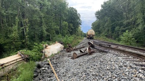 A train carrying cars full of carbon dioxide derails in Brandon, Mississippi, due to heavy rains.