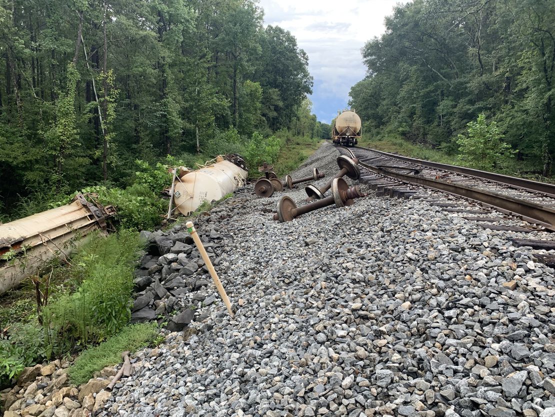 A train carrying cars full of carbon dioxide derails in Brandon, Mississippi, due to heavy rains.