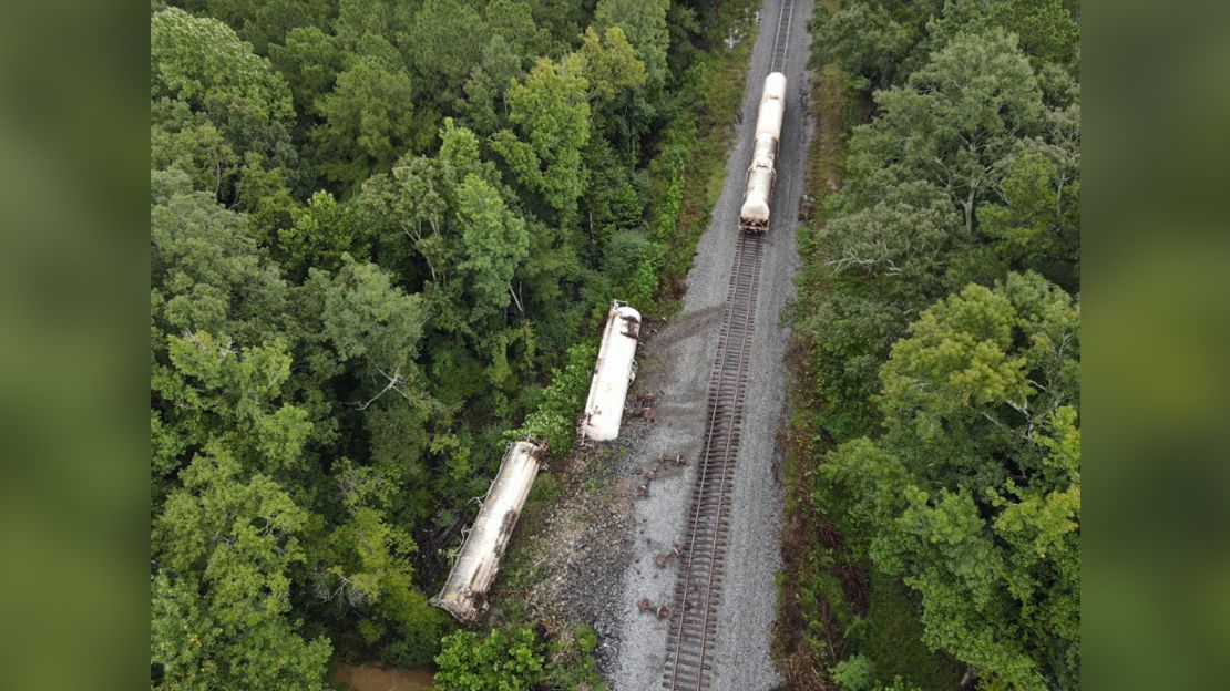 Two train cars carrying carbon dioxide became detached and rolled into the embankment near Brandon, Mississippi.