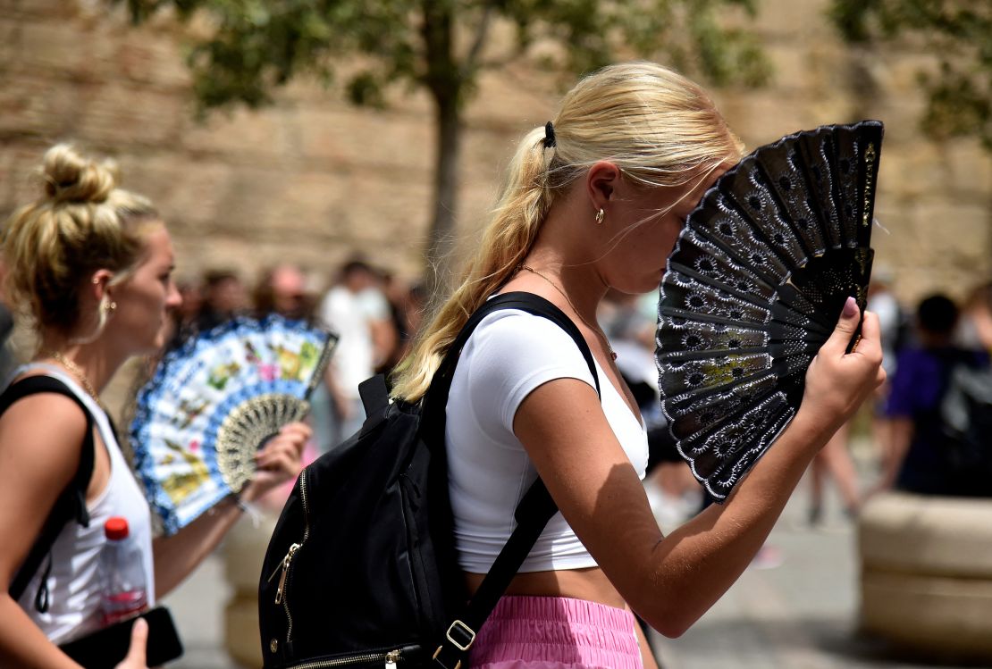 Women fighting the heat in Seville, Spain on June 13, 2022.