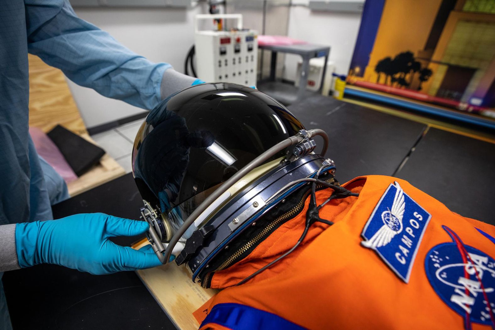 Teams from Johnson Space Center, Exploration Ground Systems and Jacobs TOSC conduct final inspections of a mannequin on November 9, 2021. The mannequin, called Commander Moonikin Campos in honor of NASA engineer <a href="index.php?page=&url=https%3A%2F%2Fwww.cnn.com%2F2021%2F06%2F29%2Fus%2Fnasa-artemis-moonikin-arturo-campos-scn%2Findex.html" target="_blank">Arturo Campos</a>, is one of three mannequins that will take the place of humans aboard the Orion spacecraft.