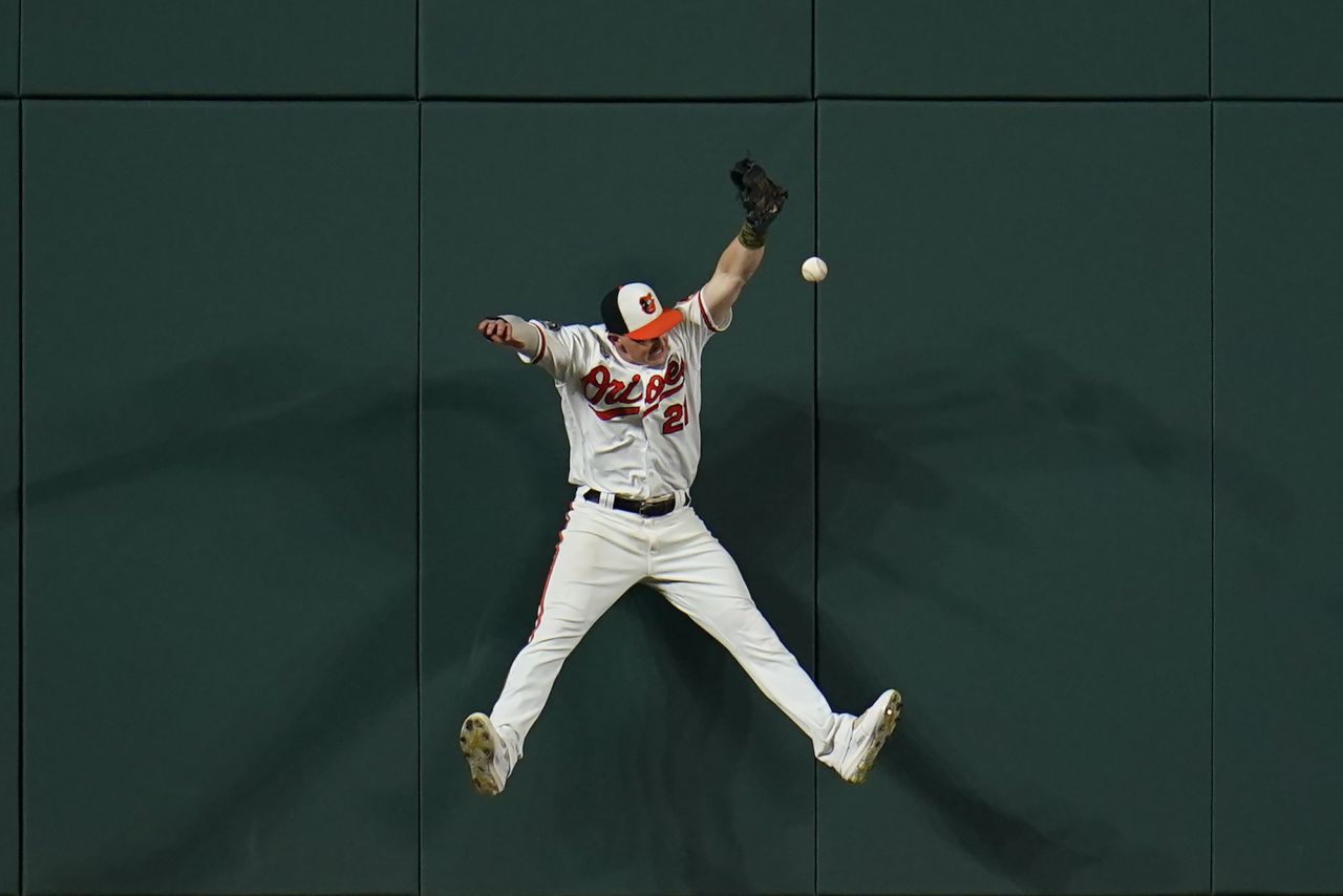 Baltimore Orioles left fielder Austin Hays attempts to make a catch during a game against the Chicago White Sox in Baltimore on Tuesday, August 23. 