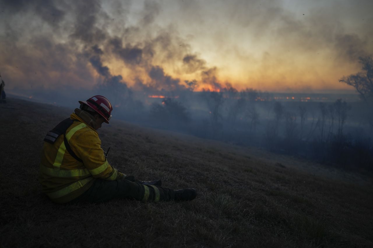 A fireman rests after fighting a wildfire in Victoria, Argentina, on Friday, August 19.