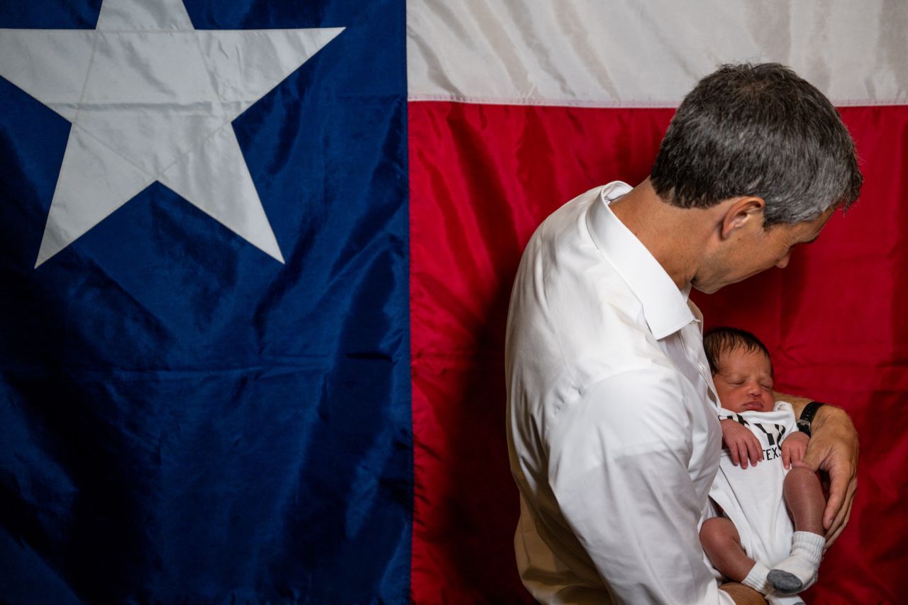 Texas Democratic gubernatorial candidate Beto O'Rourke holds 10-day-old Davis Roddy for a picture during a campaign rally in Humble, Texas, on Wednesday, August 24.