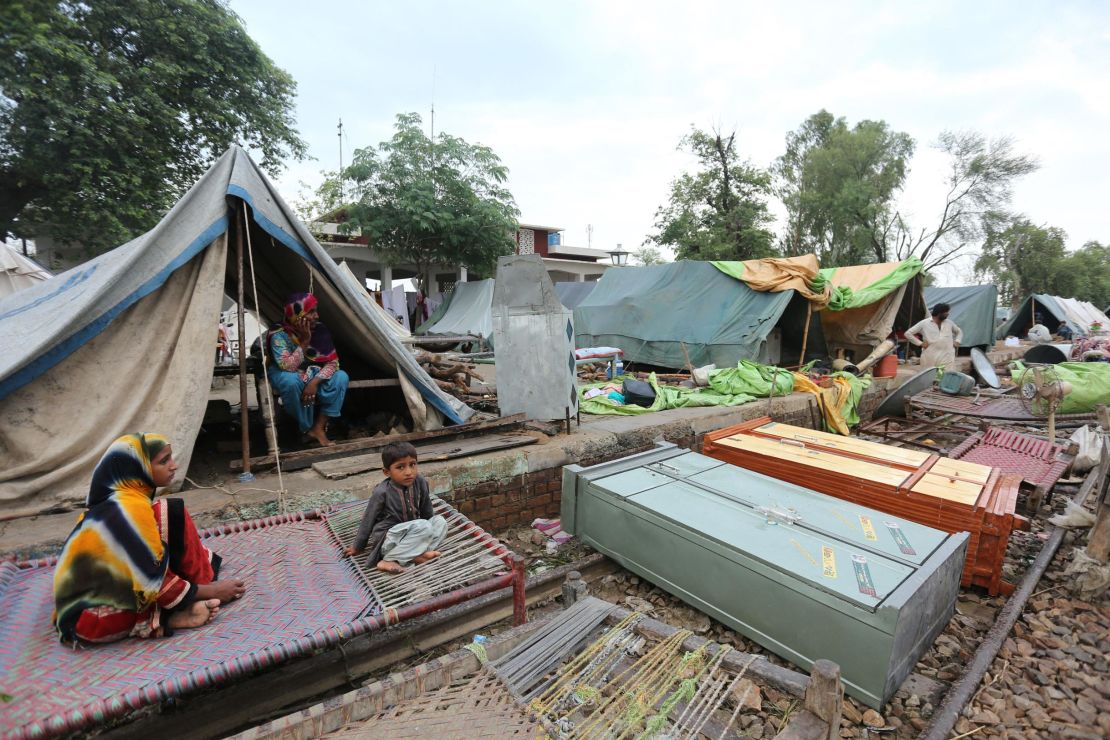 Residents take shelter at a makeshift camp in Rajanpur district, in Pakistan's Punjab province on August 24.