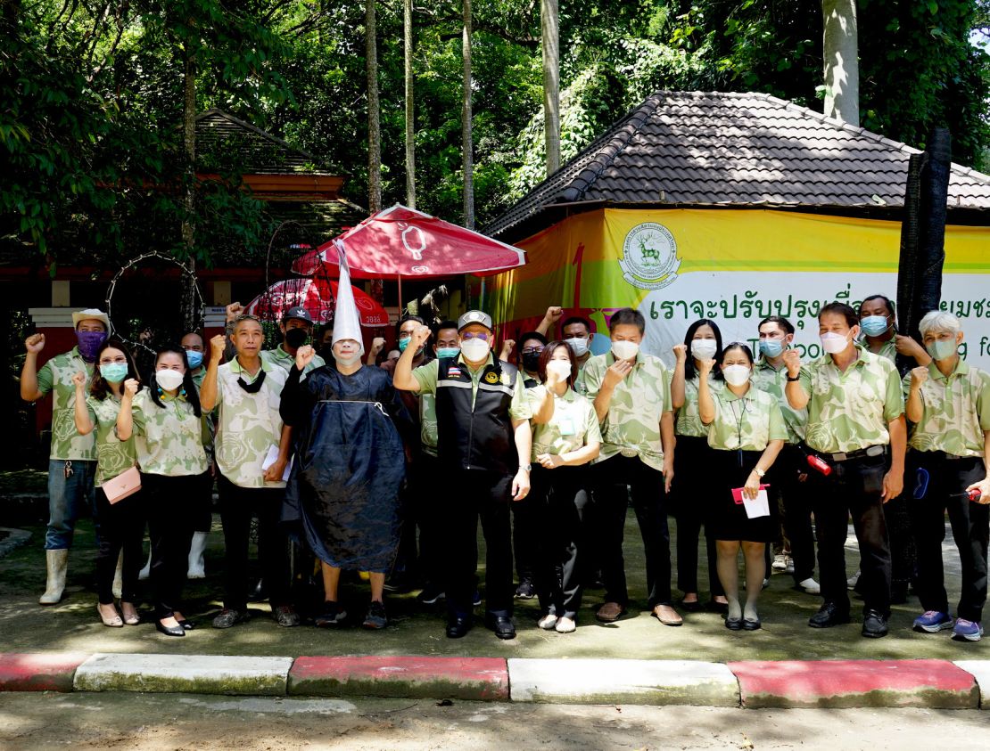 Staff at the Chiang Mai Zoo in Thailand, including a man dressed as an ostrich, pose after conducting a practice drill for escaped animals.