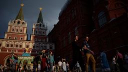 People walk along Red Square in downtown Moscow on July 23, 2022. 
