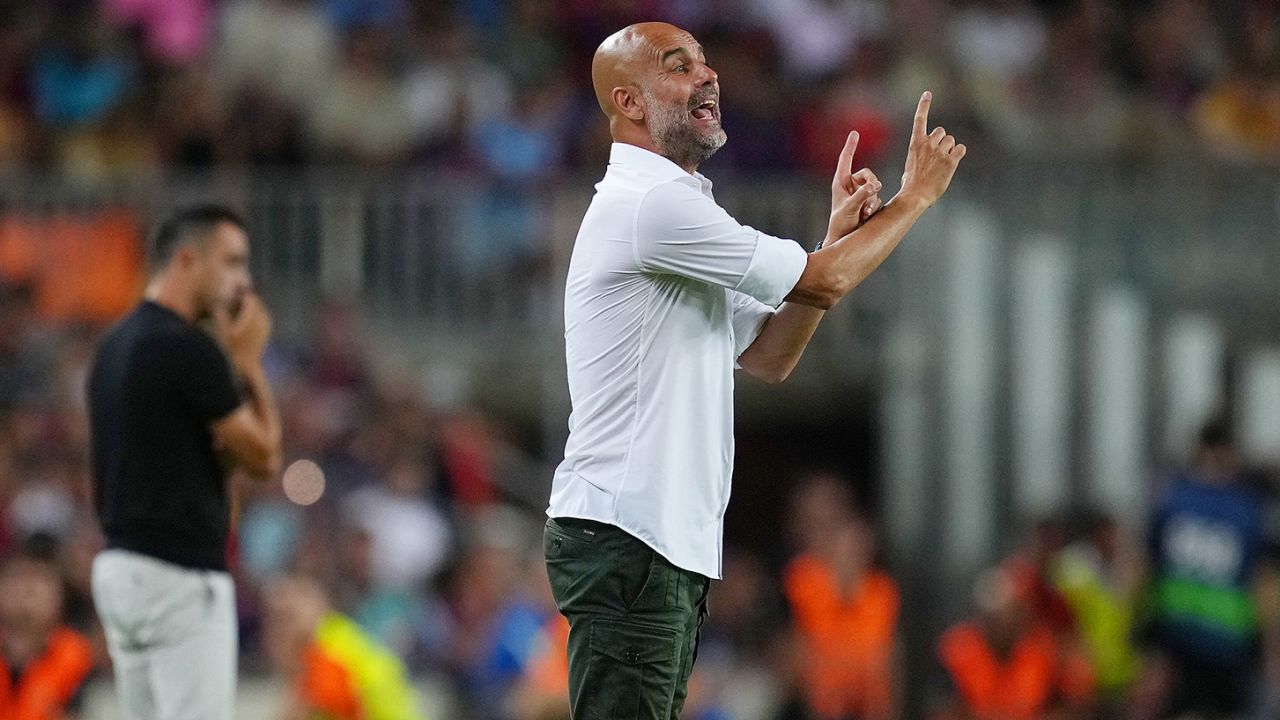 Guardiola delivers instructions to his Manchester City side against Barcelona. 