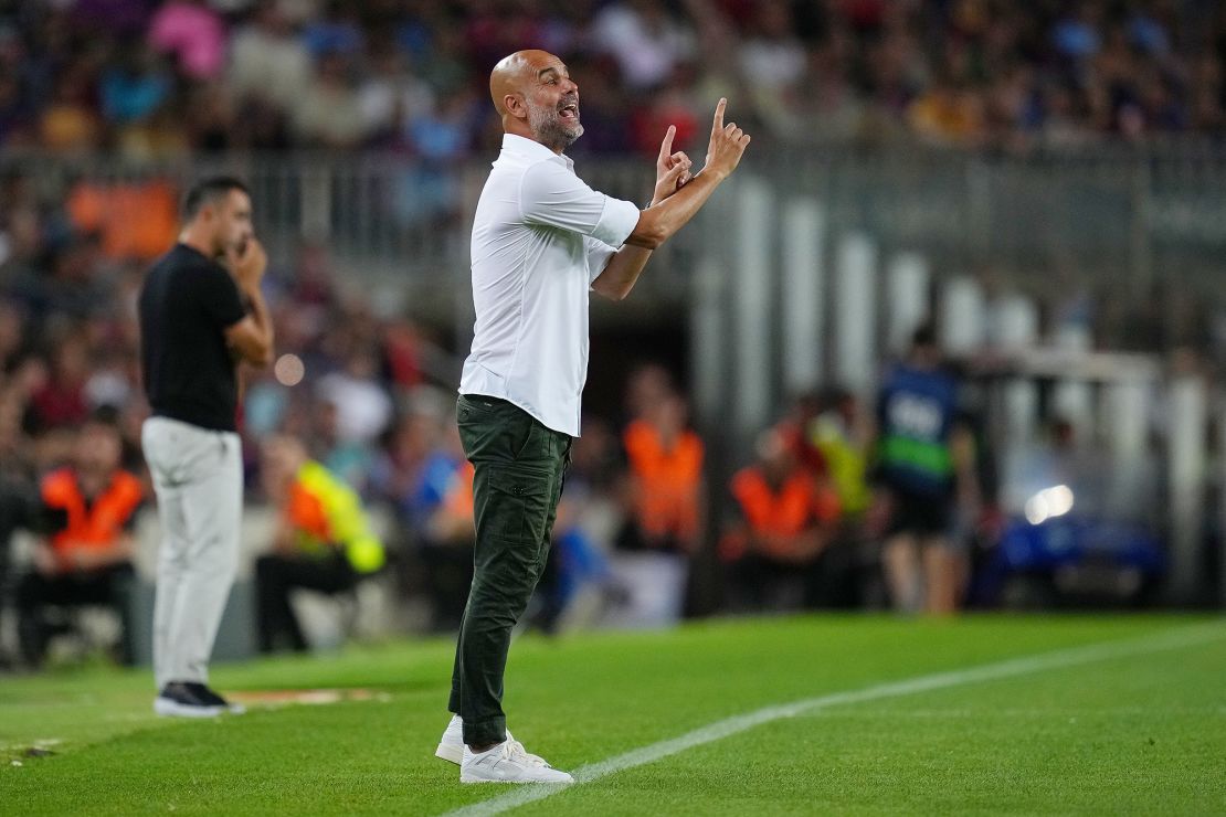 Guardiola delivers instructions to his Manchester City side against Barcelona. 