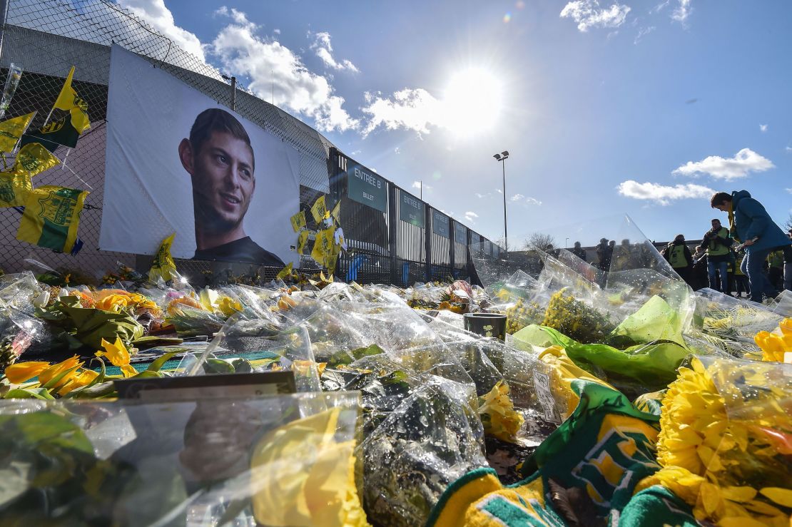 FC Nantes supporters gather in front of a portrait of late Argentinian forward Emiliano Sala at the La Beaujoire stadium on February 10, 2019.