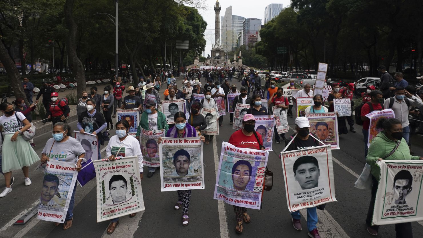 Family members and friends march for justice for the missing 43 students in Mexico City on August 26, 2022.