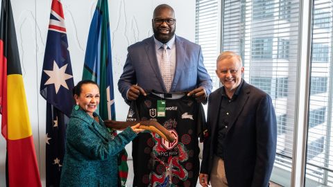 Australian Prime Minister Anthony Albanese (right), Minister for Indigenous Australians Linda Burney (left) and former NBA star Shaquille O'Neal (middle) exchange gifts before a press conference in Sydney, August 27, 2022.
