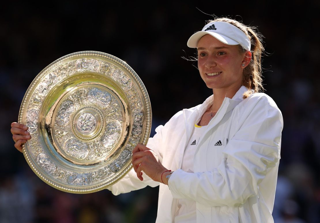 Rybakina celebrates with the trophy after beating Ons Jabeur in the Wimbledon final.