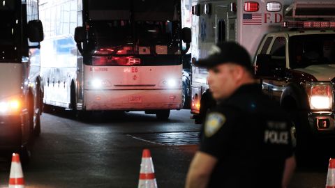 A bus carrying migrants who crossed the border from Mexico into Texas arrives into the Port Authority station Thursday. 