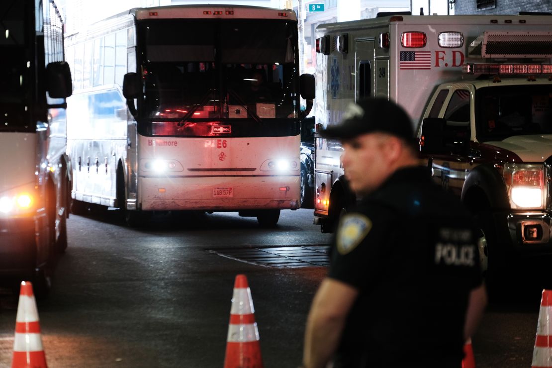 A bus carrying migrants who crossed the border from Mexico into Texas arrives into the Port Authority station Thursday. 