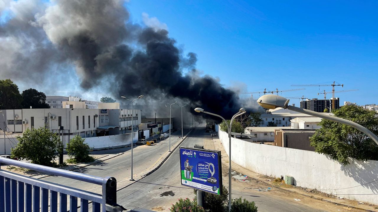 Smoke rises in the sky following clashes in Tripoli, Libya, August  27, 2022. 