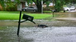 A mailbox stands in floodwaters from heavy rains that have plagued the region in recent days on Foxboro Drive in northeast Jackson, Miss., Wednesday, Aug. 24, 2022. Torrential rains and flash flooding prompted rescue operations, closures and evacuations in the central part of the state. (Hannah Mattix/The Clarion-Ledger via AP)