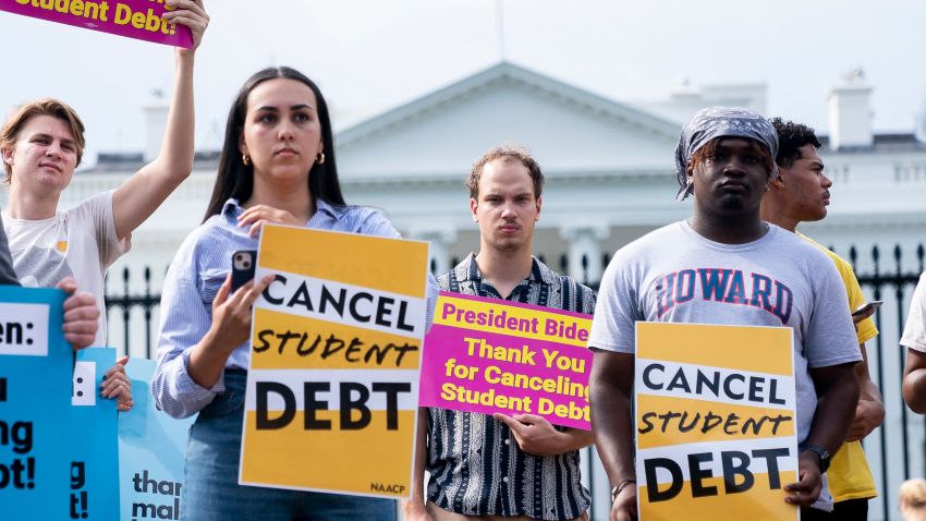 Activists gather to rally in support of cancelling student debt, in front of the White House in Washington, DC, on August 25, 2022. - Biden announced on August 24, 2022, that most US university graduates still trying to pay off student loans will get $10,000 of relief to address a decades-old headache of massive educational debt across the country. (Photo by Stefani Reynolds / AFP) (Photo by STEFANI REYNOLDS/AFP via Getty Images)