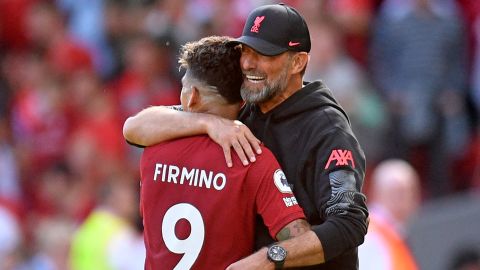 Klopp hugs Firmino as he is substituted against Bournemouth.