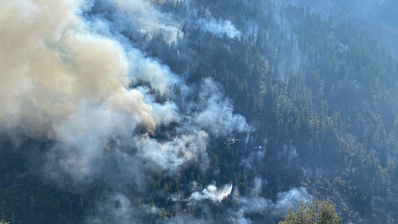 A helicopter drops water on the Rum Creek Fire in Oregon, on Thursday, August 25, 2022.