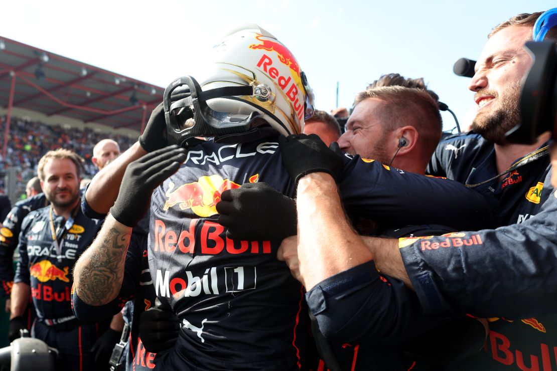 Verstappen celebrates with his Red Bull team after winning the Belgian GP. 