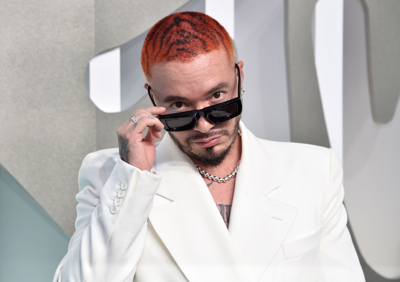 Always one to elevate menswear, J Balvin's ivory approach to suiting by Louis Vuitton featured wide-legged trousers and a double-breasted blazer, and Tiffany & Co. jewellery.