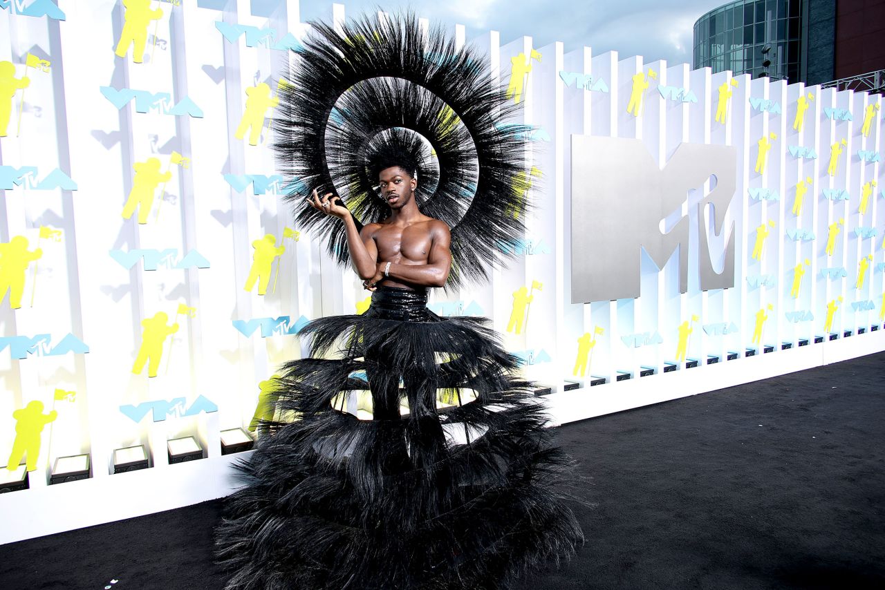 Lil Nas X attends the 2022 MTV VMAs wearing Harris Reed. The look came from Reed's Sixty Years a Queen collection.