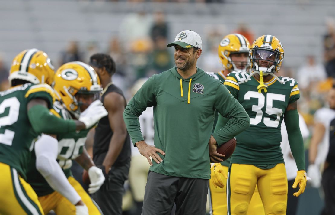Rodgers walks on the field before a preseason game against the New Orleans Saints.
