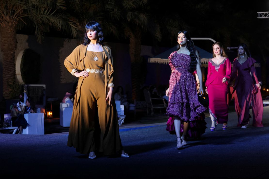 Models display the latest collection during Jimmy Fashion Show, where local and international fashion designers launched their collections in Riyadh, Saudi Arabia, on Friday. Saudi designers faced difficulties in the past before easing restrictions in the kingdom, having to travel abroad to showcase their work.