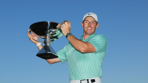 Rory McIlroy celebrates with the 2022 FedEx Cup after winning during the final round of the PGA Tour Championship at East Lake Golf Club.