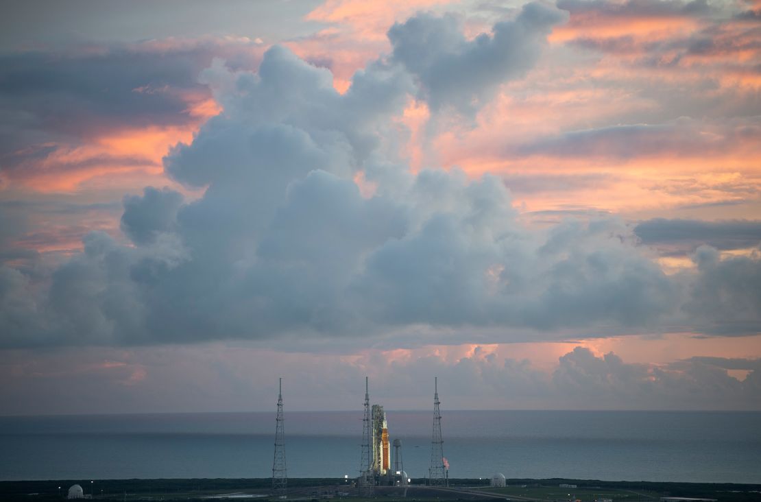 NASA's Space Launch System rocket and Orion spacecraft sit on the launchpad.