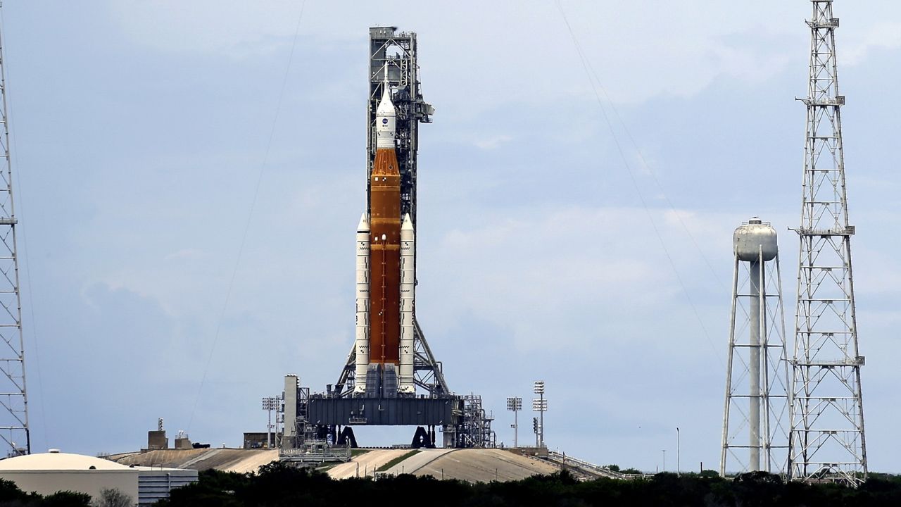 The NASA moon rocket stands ready less than 24 hours before it is scheduled to launch on Pad 39B for the Artemis 1 mission to orbit the moon at the Kennedy Space Center, Sunday, Aug. 28, 2022, in Cape Canaveral, Fla. (AP Photo/John Raoux)