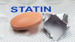 Close up of a generic statin tablet on a blister pack. 