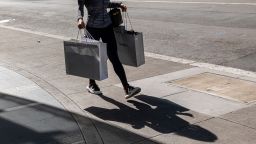 A pedestrian carries shopping bags in San Francisco, California, US, on Wednesday, June 1, 2022. 