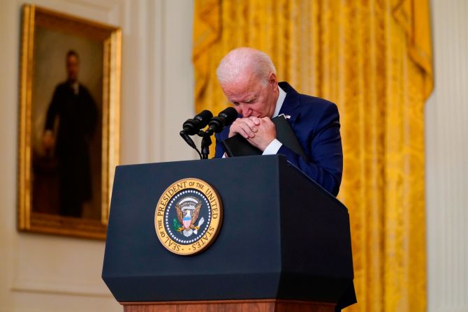 Biden pauses as he listens to a question about <a href="index.php?page=&url=https%3A%2F%2Fwww.cnn.com%2F2021%2F08%2F26%2Fmiddleeast%2Fgallery%2Fkabul-deadly-blasts-afghanistan-airport%2Findex.html" target="_blank">a suicide bombing</a> that took place outside the international airport in Kabul in August 2021. The attack killed dozens of Afghan civilians and 13 US service members. The terror group ISIS-K, which rivals the Taliban in Afghanistan, claimed responsibility for the attack. Biden <a href="index.php?page=&url=https%3A%2F%2Fwww.cnn.com%2F2021%2F08%2F26%2Fpolitics%2Fbiden-kabul-attack%2Findex.html" target="_blank">vowed to retaliate.</a> "We will not forgive. We will not forget. We will hunt you down and make you pay," he said.