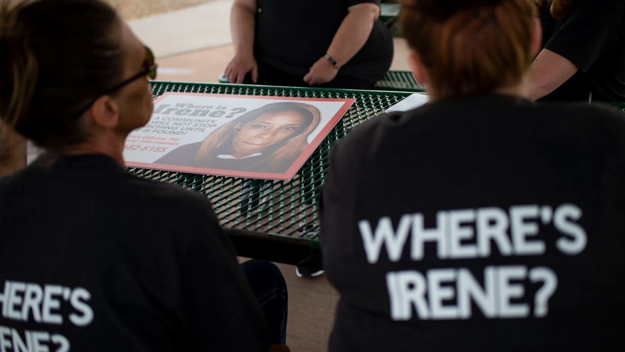 A group formed to help find Irene Gakwa prepares to post signs seeking information about the missing woman  in Gillette, Wyoming, on June 18. 
