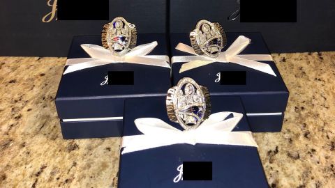 Scott V. Spina Jr. pleaded guilty to wire fraud, mail fraud and aggravated identity theft in relation these "Brady"-engraved rings. Portions of this image have been obscured by the US Attorney's Office for the Central District of California. 