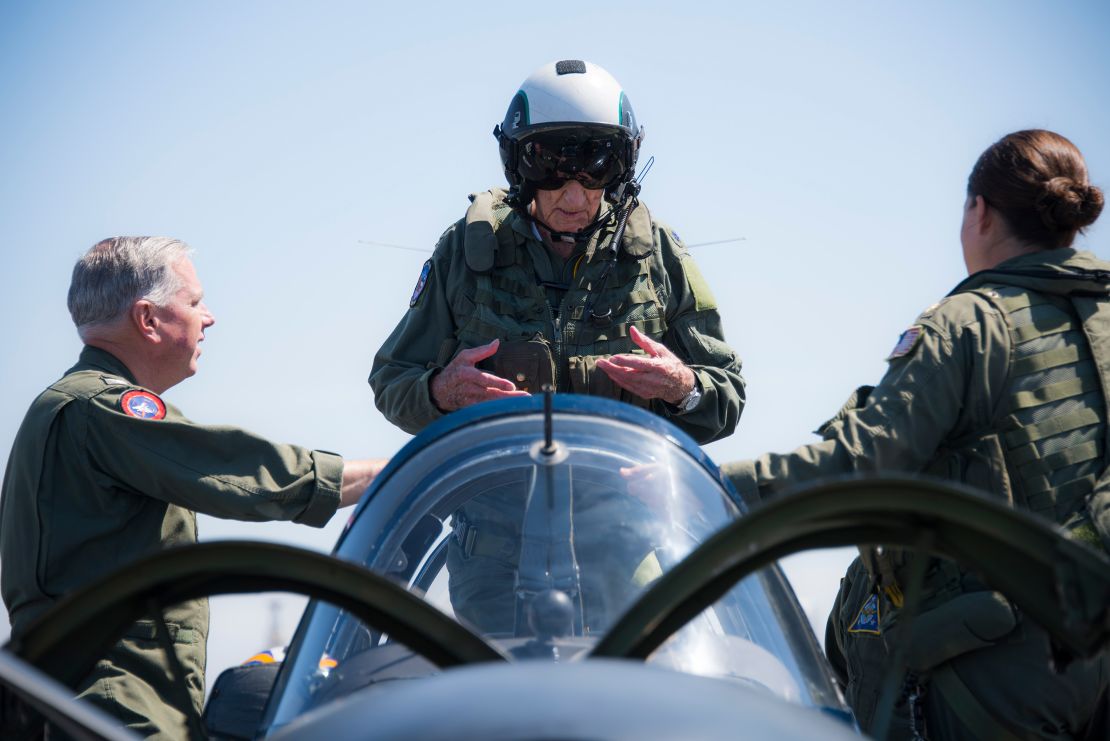 Dean "Diz" Laird, center, stands in the rear seat of a T-34C Turbomentor with the "Flying Eagles" of Strike Fighter Squadron (VFA) 122 in Coronado, California, on July 9, 2019.