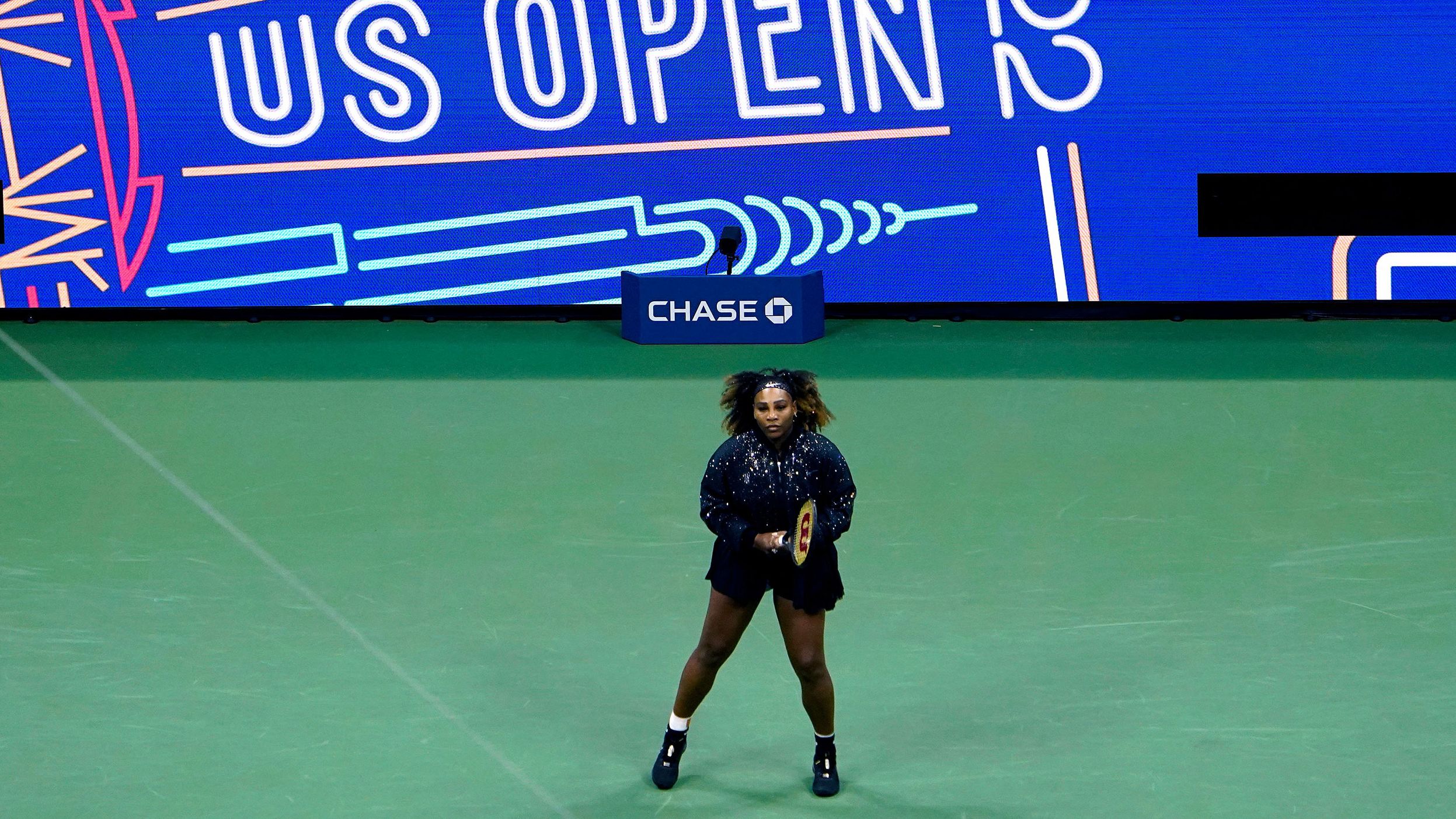 Williams warms up before her match on Monday.