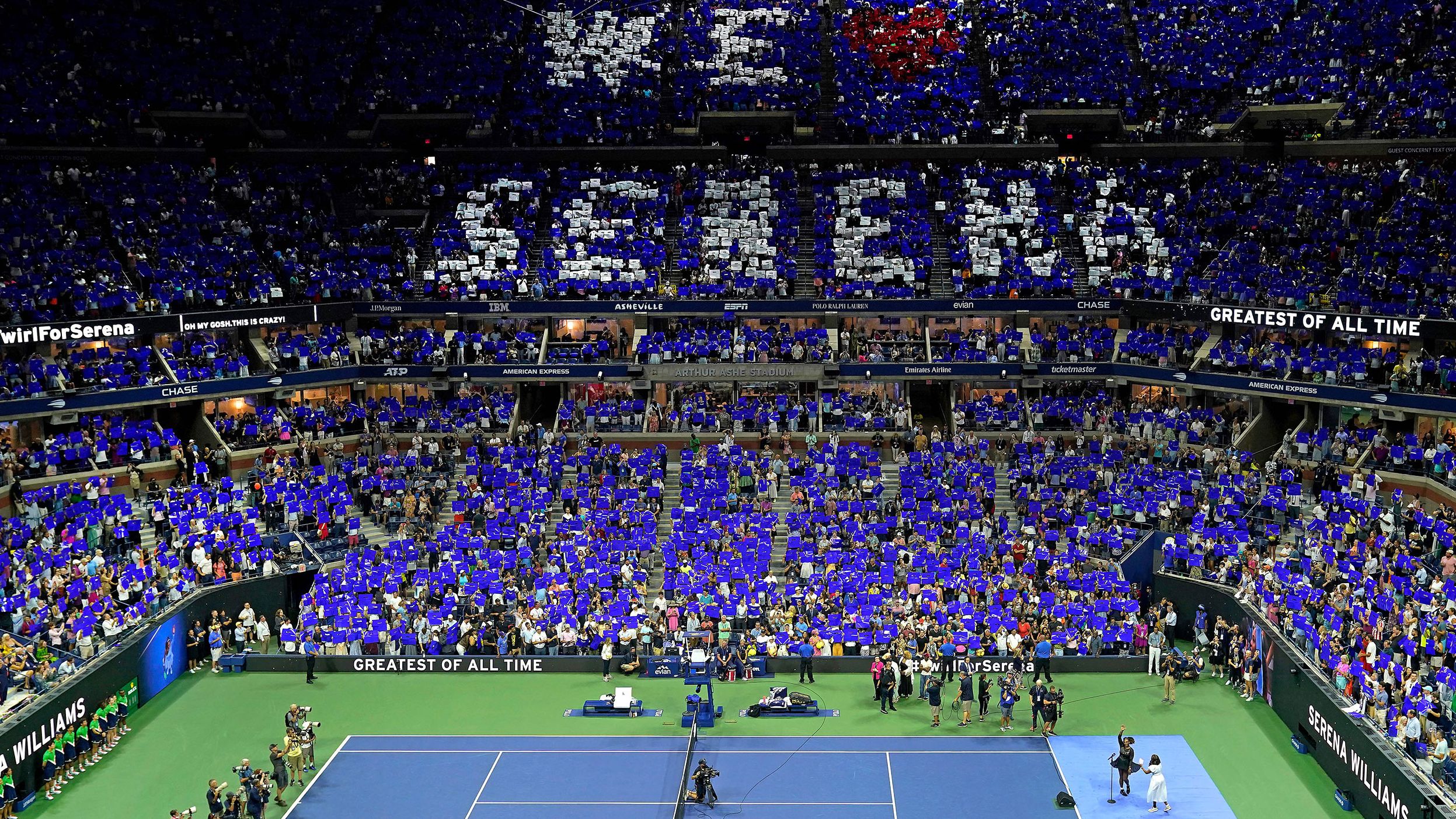 Fans at Arthur Ashe Stadium hold up signs showing their love for Williams after her first-round win at the US Open on August 29.