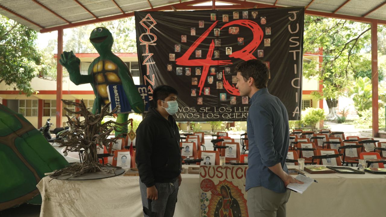 Normal de Ayotzinapa student Cesar talks to CNN's David Culver in the basketball court turned memorial for the 43 disappeared students. 