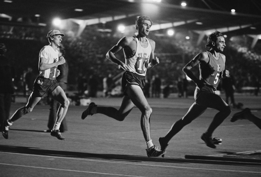 Wottle (left) races behind the US' Jim Ryun (center) at Crystal Palace in London.  