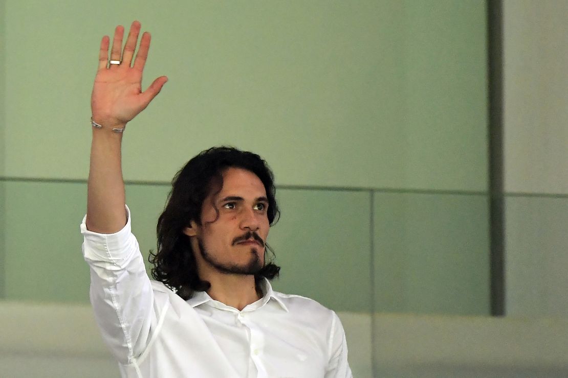 Cavani waves to fans at the Mestalla.