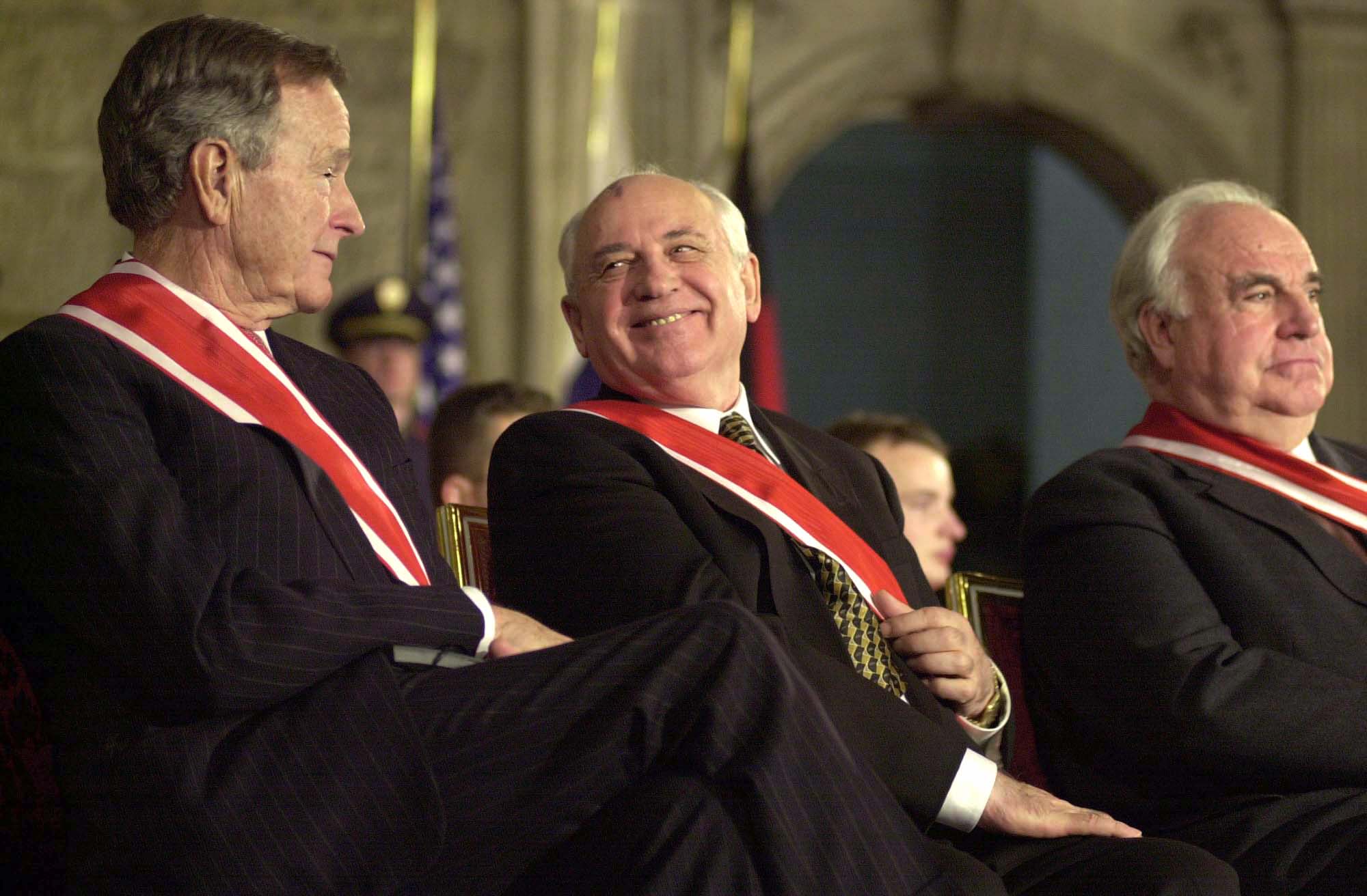 From left, Bush, Gorbachev and former German Chancellor Helmut Kohl attend a ceremony in 1999.