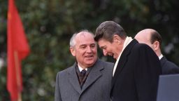 U.S. President Ronald Reagan, right, talks with Soviet leader Mikhail Gorbachev during arrival ceremonies at the White House where the superpowers begin their three-day summit talks in Washington, D.C., Tuesday, Dec. 8, 1987.  (AP Photo/Boris Yurchenko)