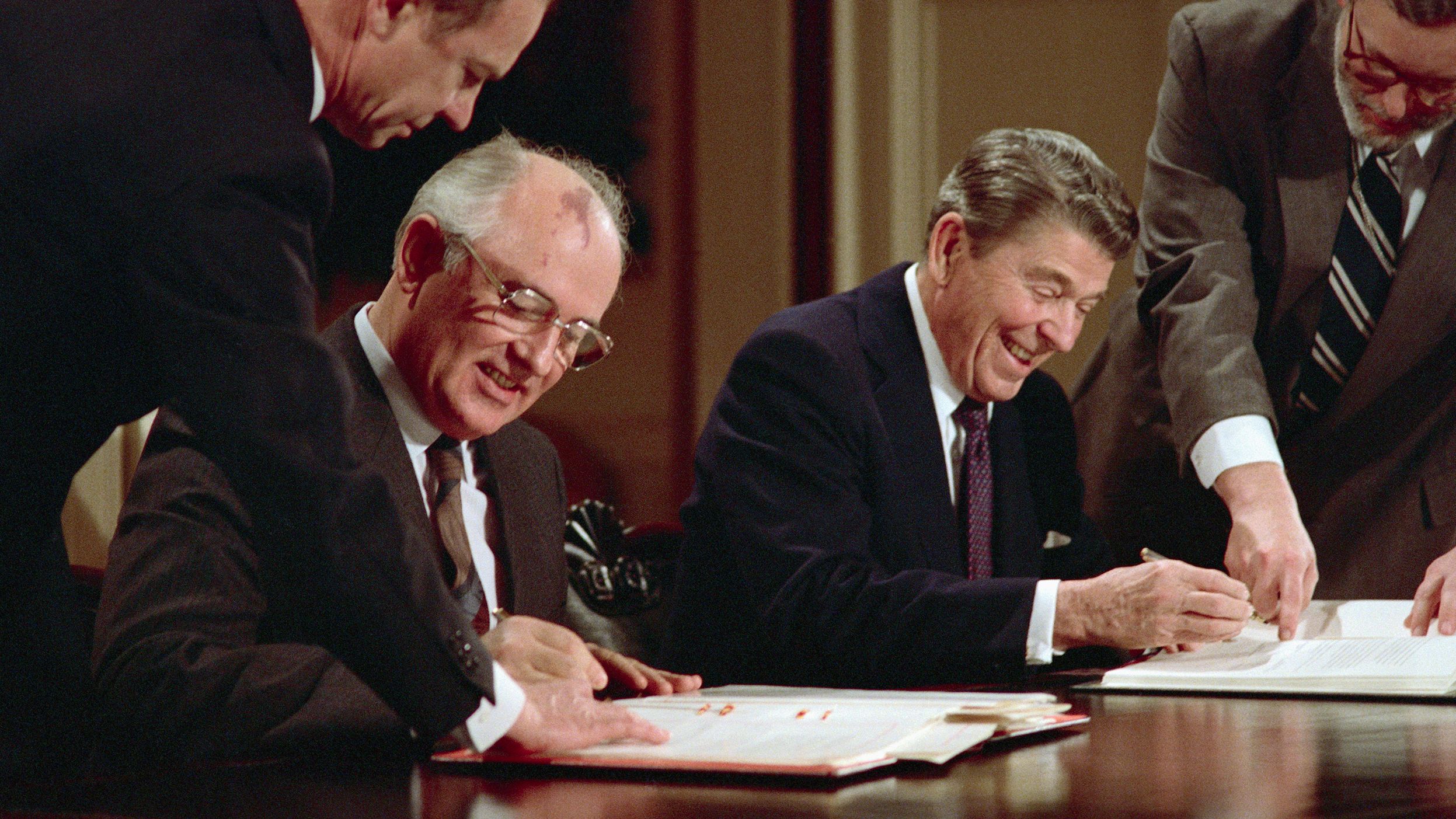 Gorbachev and Reagan sign an arms control agreement in December 1987 banning the use of intermediate-range nuclear missiles.