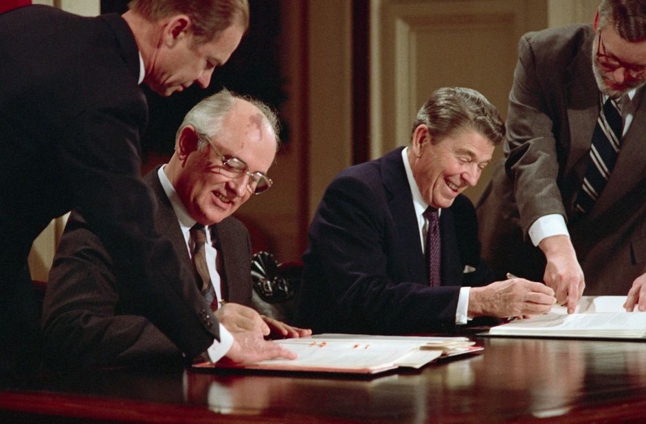 Gorbachev and Reagan sign an arms control agreement in December 1987 banning the use of intermediate-range nuclear missiles.