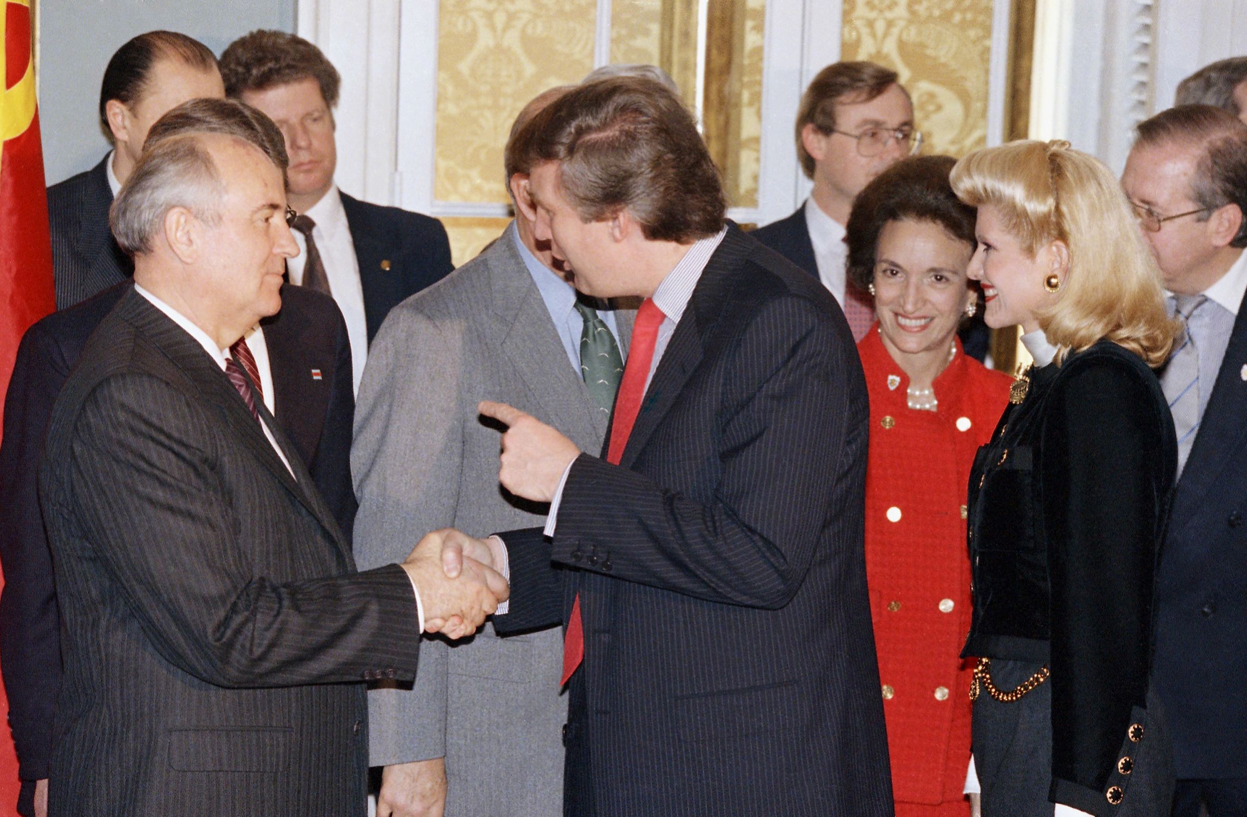 Gorbachev shakes hands with businessman Donald Trump at the US State Department in December 1987.